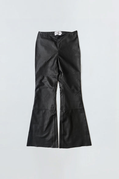 Low waisted black leather Kick Pants by Deadwood, slim-fit Y2K kick-flare made of sustainable recycled leather.