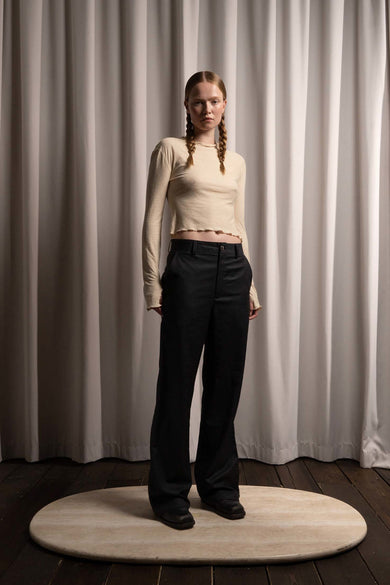 Flint straight-fit slack pants by Deadwood for women, front view featuring classic silhouette and slanting side pockets, crafted from deadstock wool fabrics.
