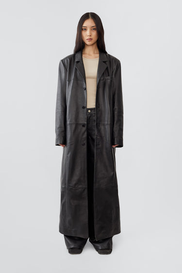 Vargen ultra-long leather coat by Deadwood, oversized fit with front button closure, crafted from upcycled lambskin.
