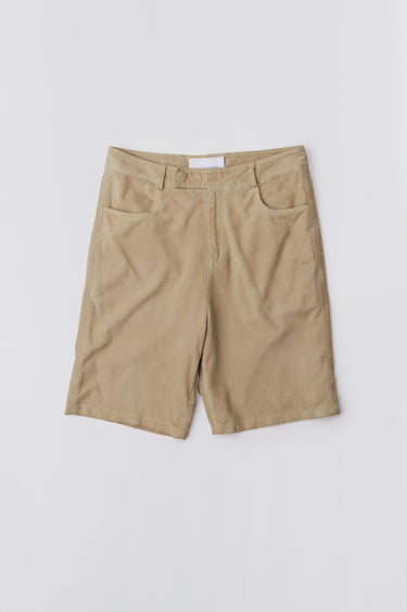 Deadwood knee-length suede board shorts in the color lime. Hook and zipper closure and right back pocket. Made from recycled suede.