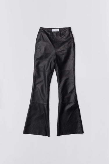 Black leather Kick Pants by Deadwood, slim-fit Y2K kick-flare with sustainable recycled materials.