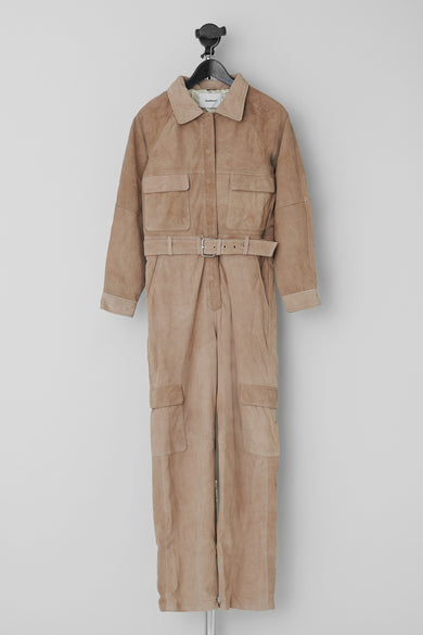 Juno jumpsuit by Deadwood in beige color, made from recycled suede leather with waist-accentuating belt.