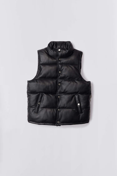 Men’s Vermont black leather puffer vest by Deadwood, down-free with silver-tone push button closure, waist pockets, and drawstring hem, made from upcycled leather.
